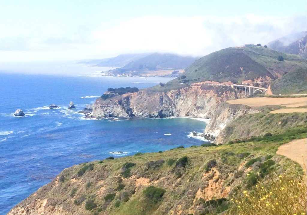 view of ocean cliffs and Bixby Bridge on Carmel to Big Sur day trip 