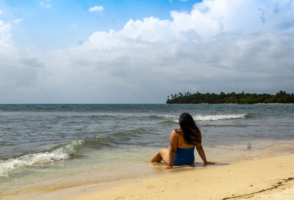 woman sitting on beach